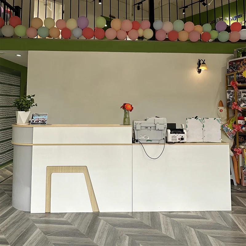 Customer reception desk setup with white counter