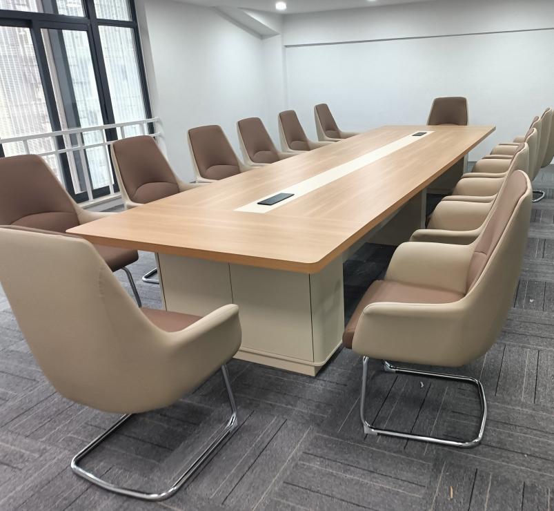 Customer conference room with long table and beige chairs