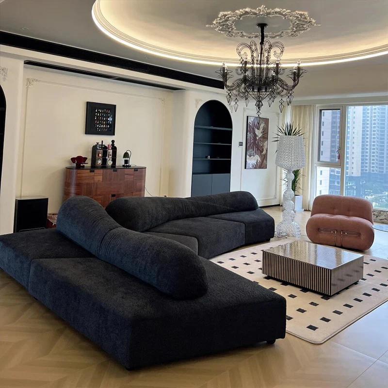 Black curved modular sofa in a customer living room